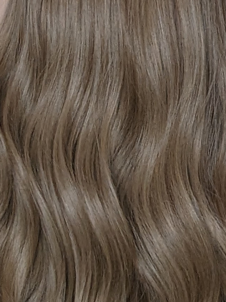 synthetic beige blonde wig close up