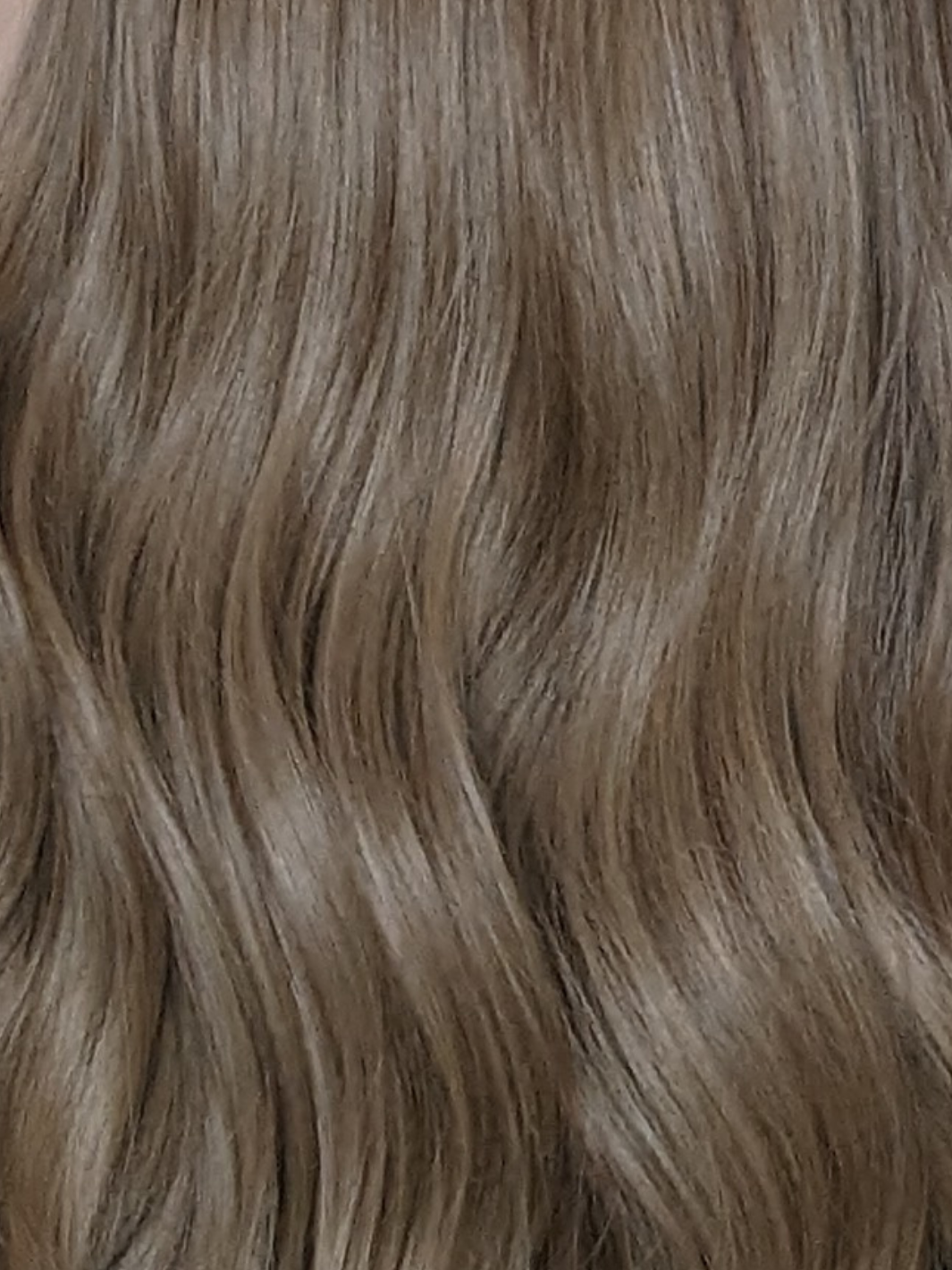synthetic beige blonde wig close up